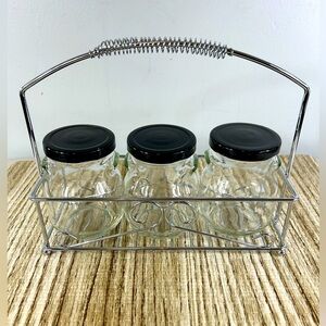 Metal rack with 3 covered jars